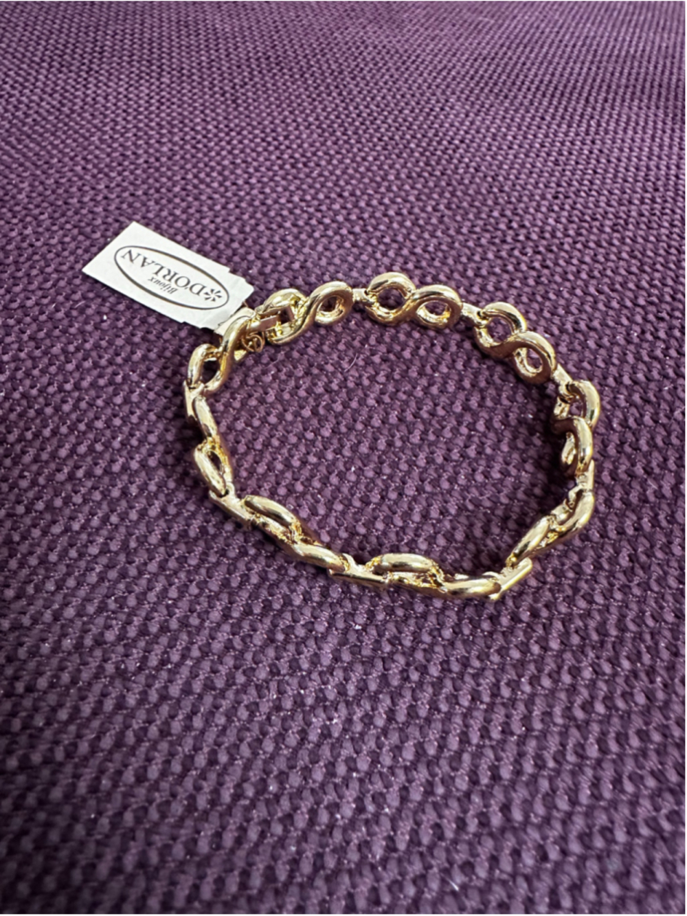 D'Orlan Gold Tone Infinity Link Bracelet